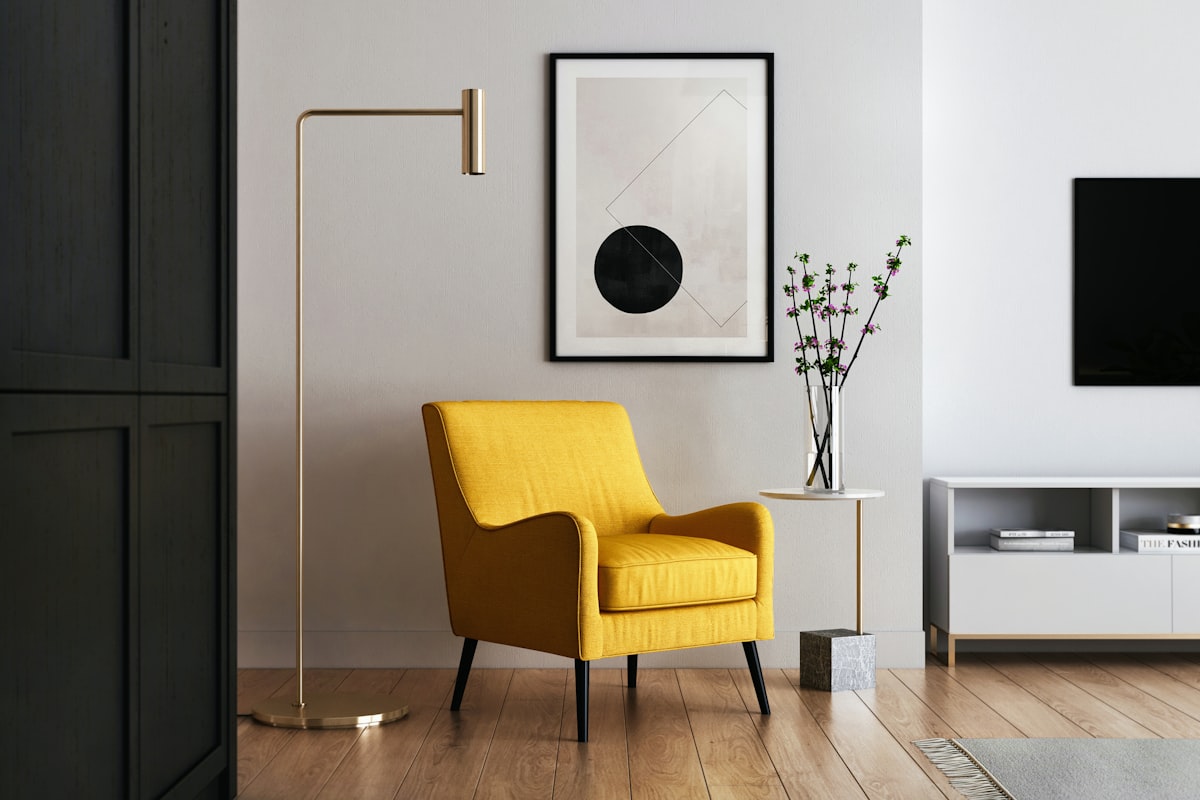 A styled corner with an accent chair, floor lamp and framed art, an example of the kind of detail shot that adds texture to a home tour reel